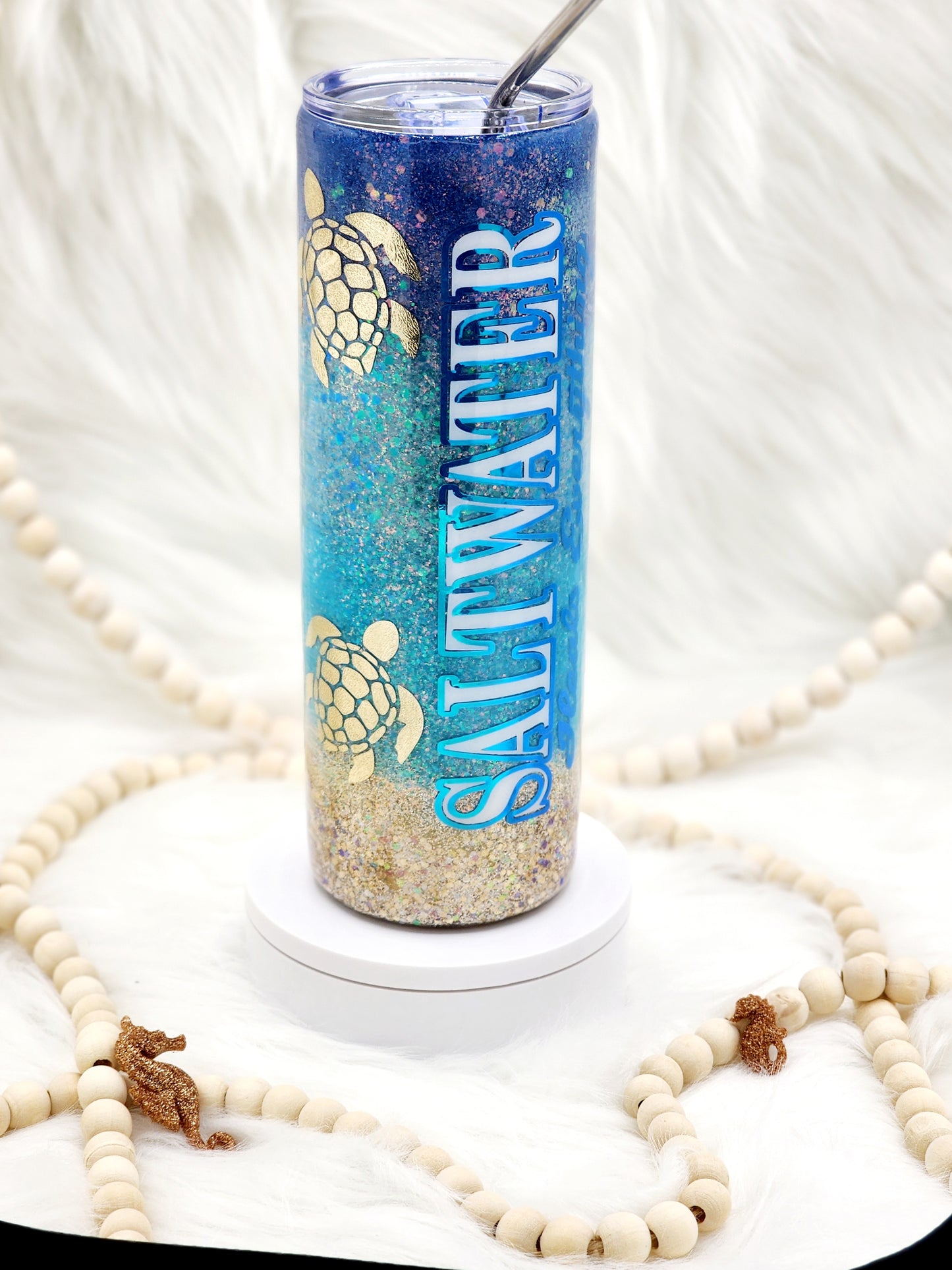 Embrace the calming and healing power of the ocean with this beautifully crafted saltwater and ocean-themed tumbler. Perfect for beach lovers and those who find solace by the sea, this tumbler combines serene design with practicality, making it an ideal accessory for any occasion. The quote "Saltwater heals everything" is elegantly displayed in a flowing script, capturing the essence of the ocean's therapeutic qualities by Tumbler Funatics.