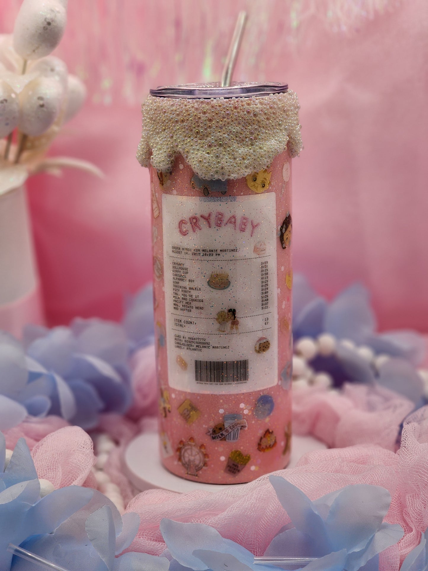 Celebrate your love for Melanie Martinez and her iconic album "Crybaby" with this unique and stylish tumbler! Perfect for fans of all ages, this tumbler captures the whimsical and bold essence of Melanie's music and aesthetic. Custom rim drip included by Tumbler Funatics.